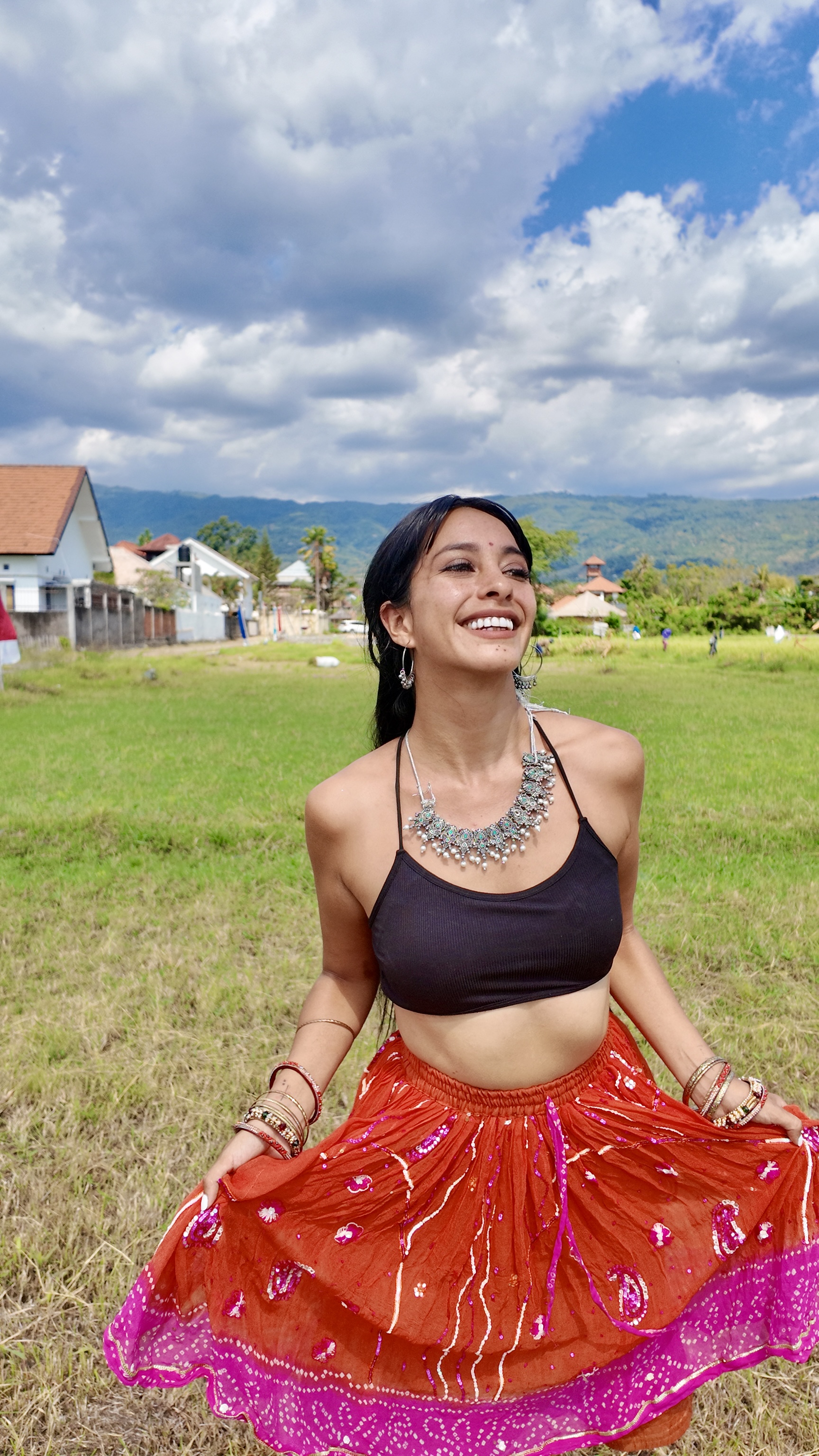Karla smiling, twirling her skirt